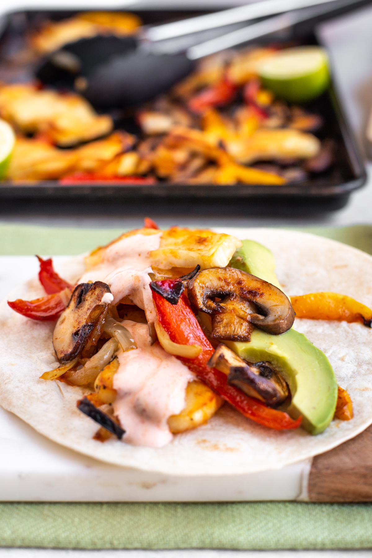 A vegetarian fajita with roasted vegetables and halloumi.