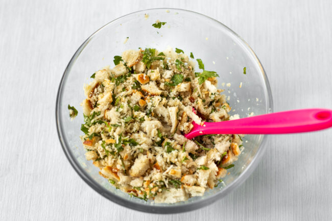 A simple bread stuffing mixture in a mixing bowl.