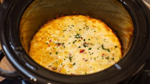 Fully cooked slow cooker corn casserole in a Crock-Pot.