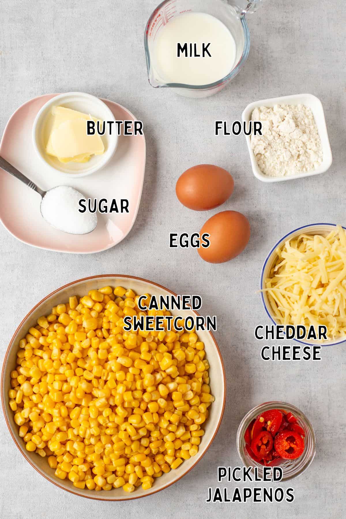 Ingredients for slow cooker corn casserole laid out with text overlay.