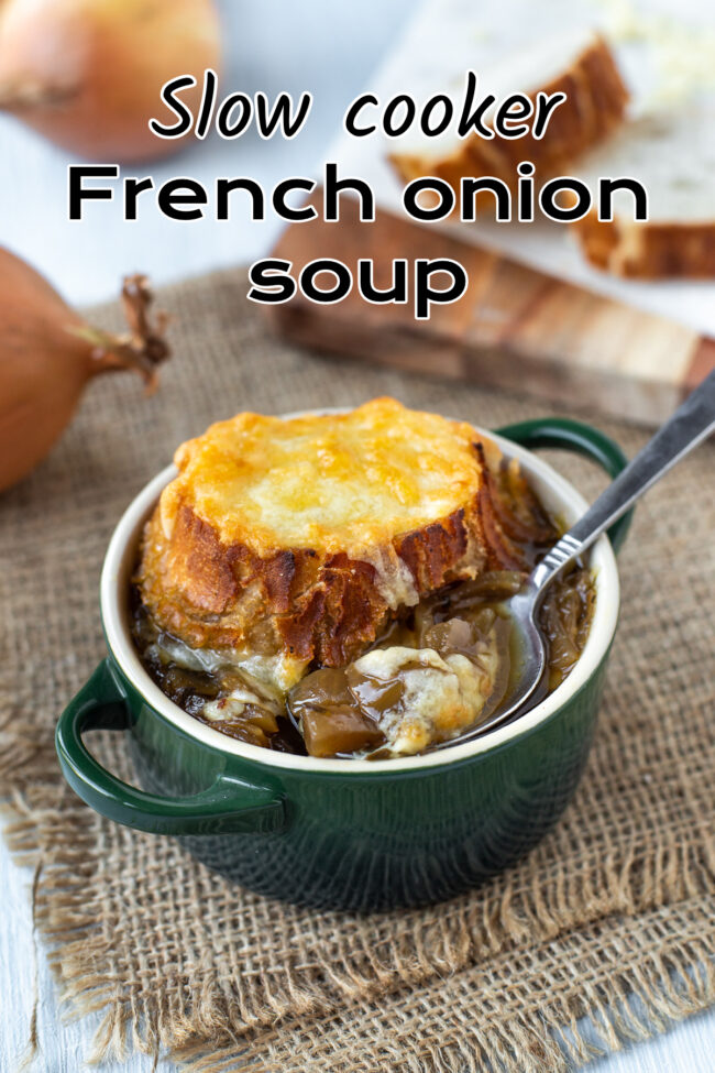 A bowl of French onion soup topped with a crispy cheese crouton.