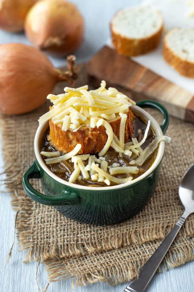 French onion soup topped with a slice of French bread and grated cheese.