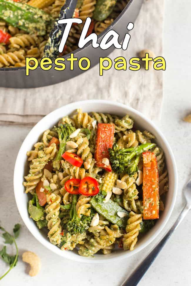 Thai pesto pasta with veggies, in a white bowl shot from above