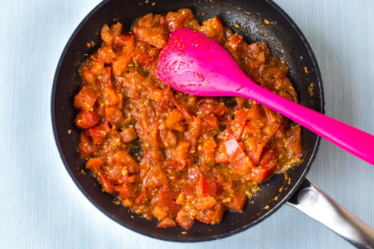 Fresh tomato sauce cooking in a frying pan.