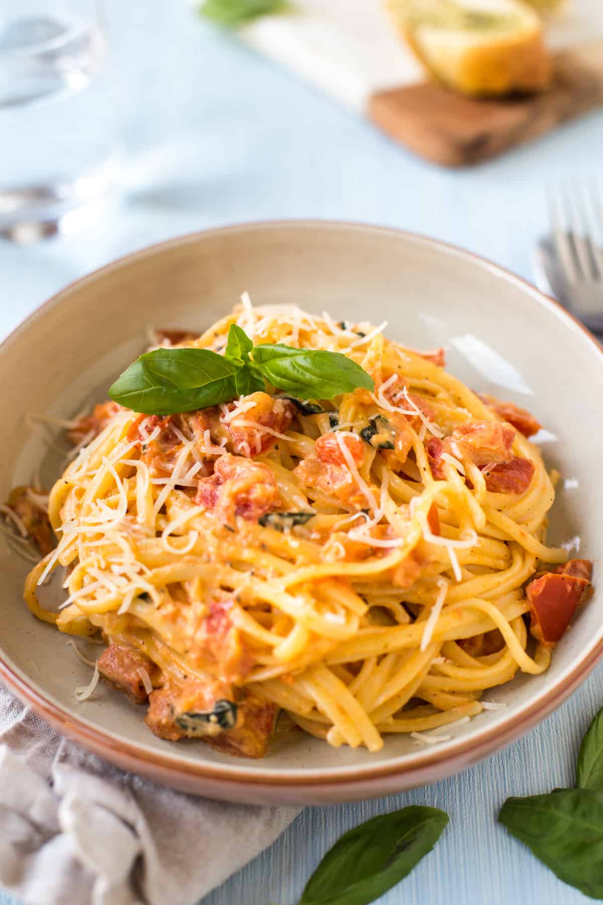 Tomato and mascarpone pasta topped with fresh basil and parmesan cheese.