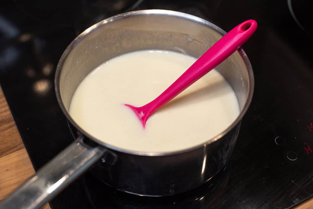 Homemade white sauce in a saucepan.