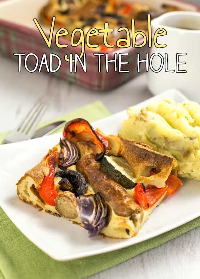 Vegetable toad in the hole - vegetarian sausages and roasted veggies, all cooked in a Yorkshire pudding batter. A classic British recipe!
