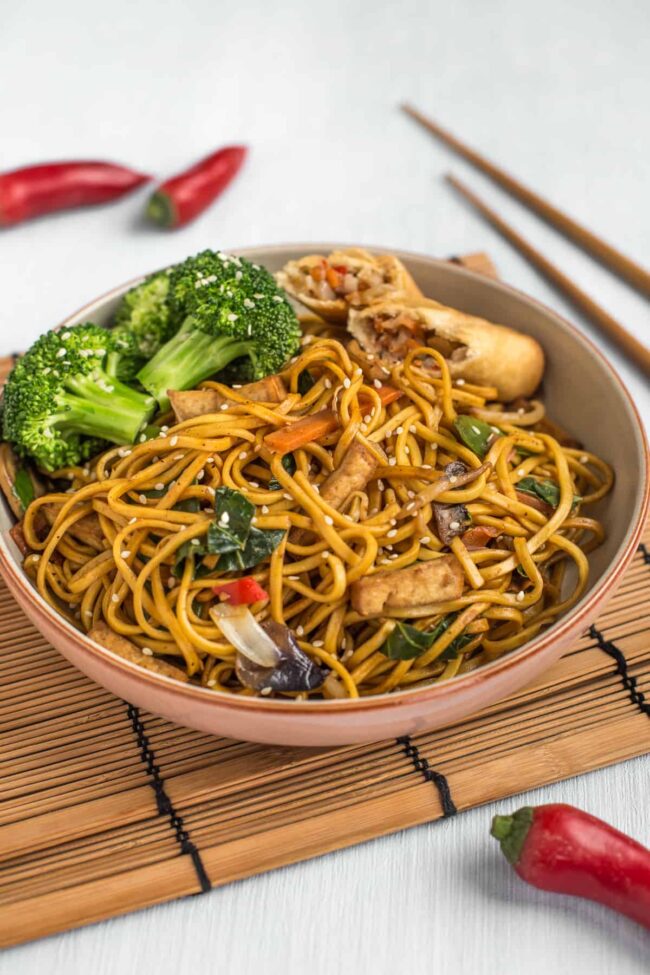 Chinese vegetable noodles with broccoli in a bowl.