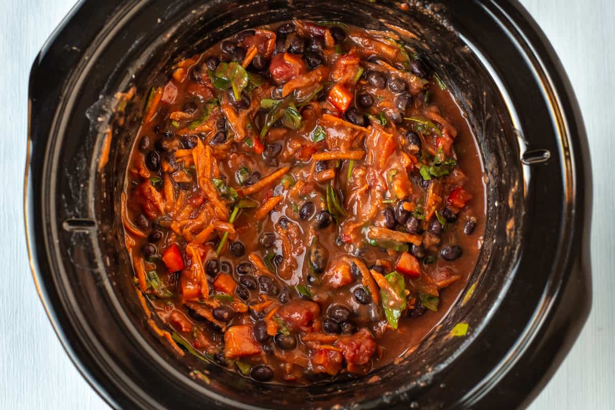 Uncooked black bean soup in a slow cooker.