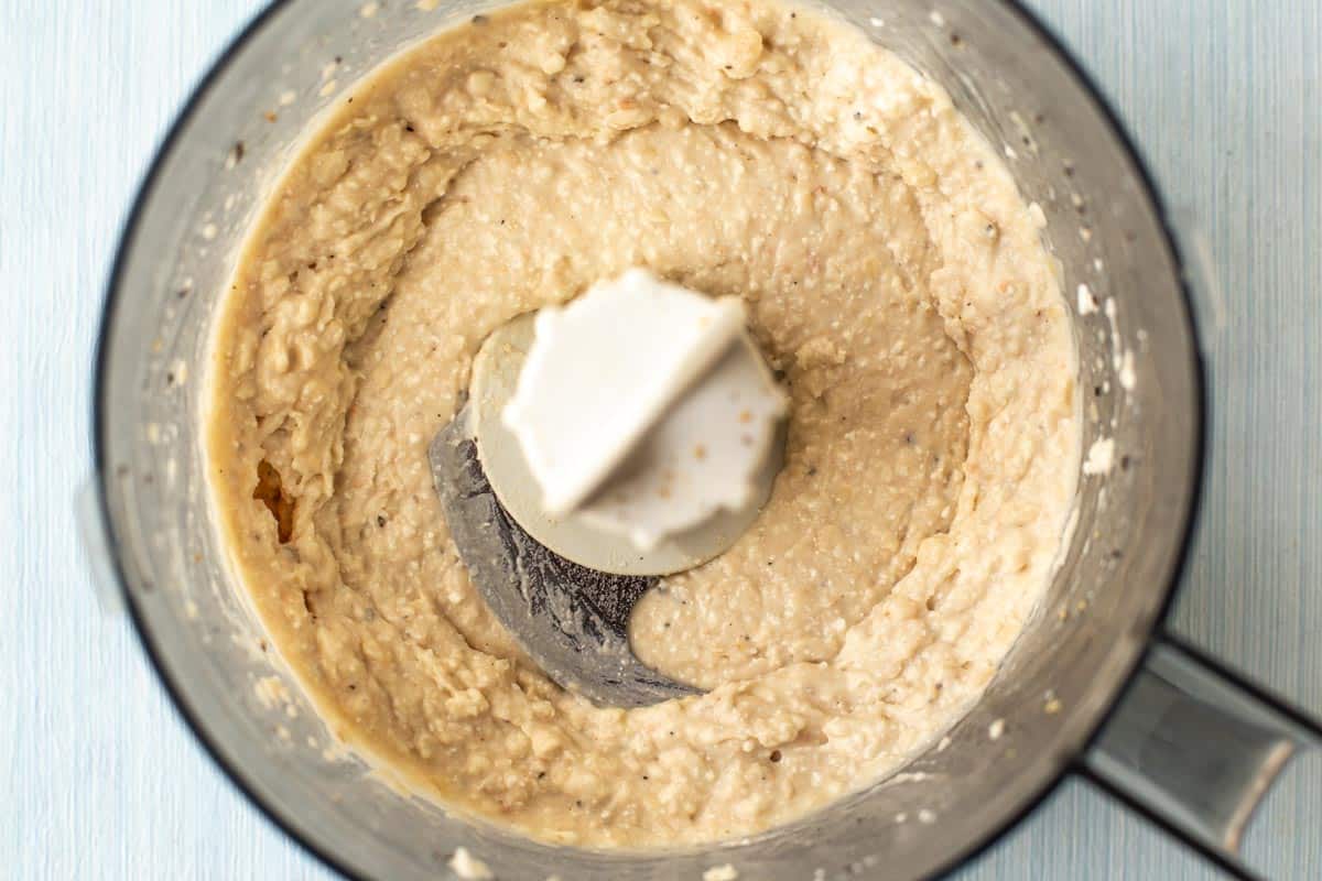 Creamy white bean hummus in a food processor.